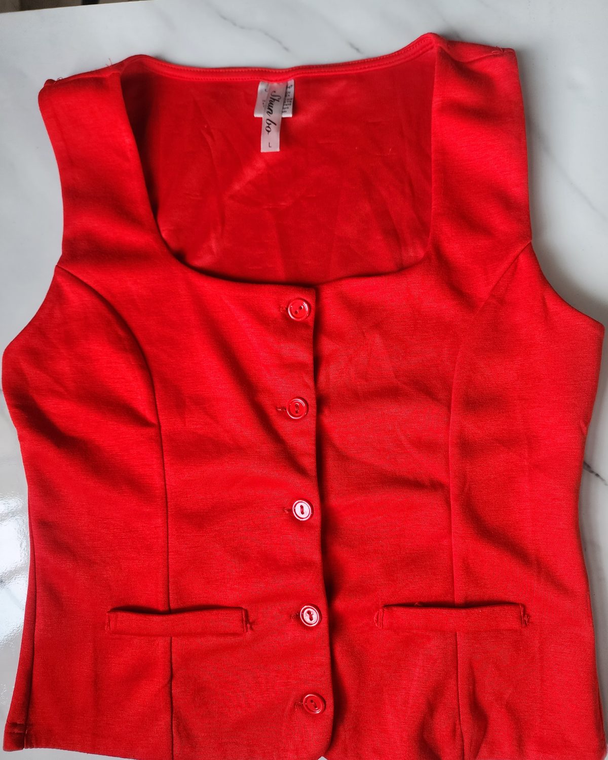 Blusa tipo camisa sin mangas
